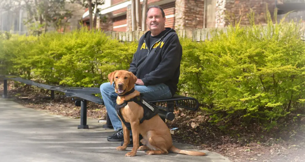 John, a U.S. Army veteran, and his service dog, Savior.