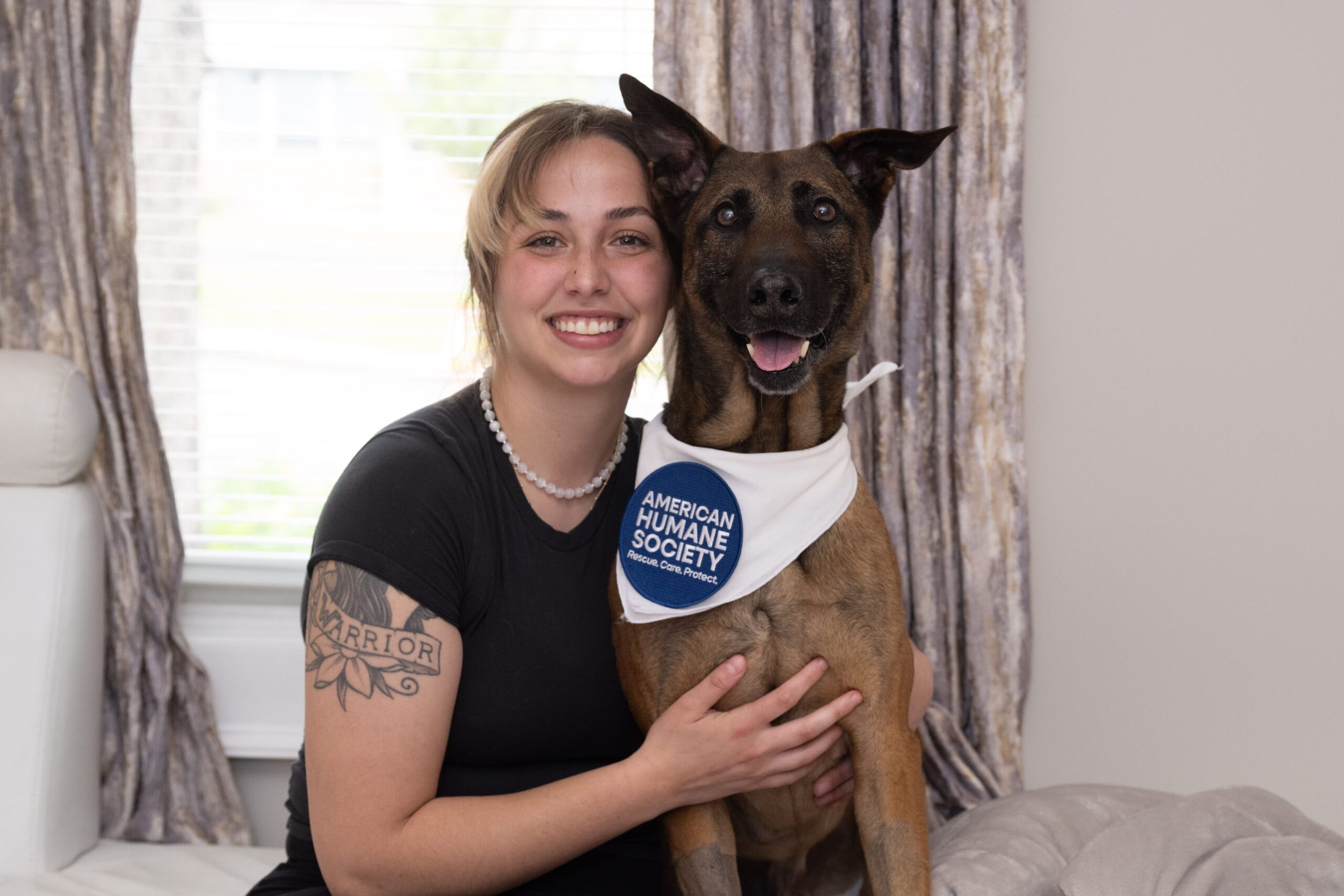 Menson at his Memorial Day reunion, facilitated by American Humane Society's MWD Reunification program.